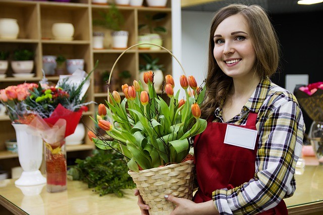 florist-holding-a-basketful-of-tulips